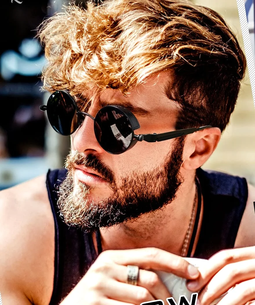 The round steampunk MTS2 in black, on a bearded man in a black vest